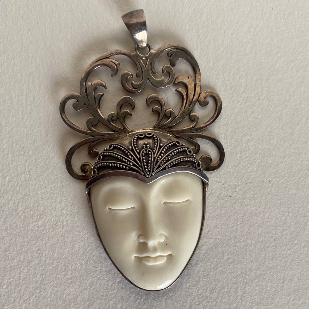 Gorgeous Sterling silver and bone face pendant